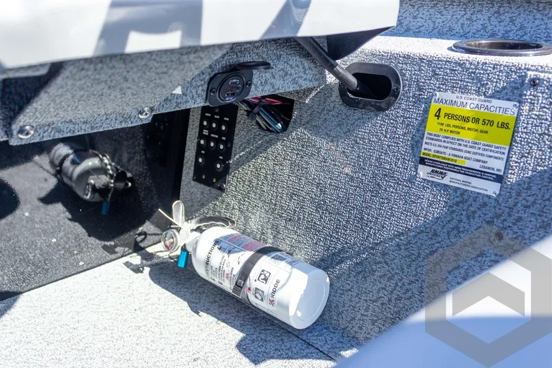 Slide: The Image of Interior of 2026 G3 Sportsman 1610 boat showing safety equipment and capacity label. - 39