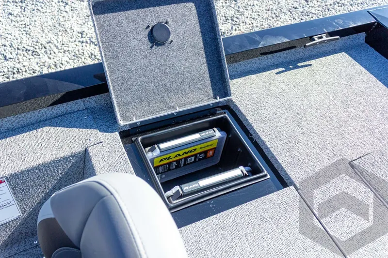 Slide: The Image of 2026 G3 Sportsman 1610 boat storage compartment with fishing gear and accessories. - 43