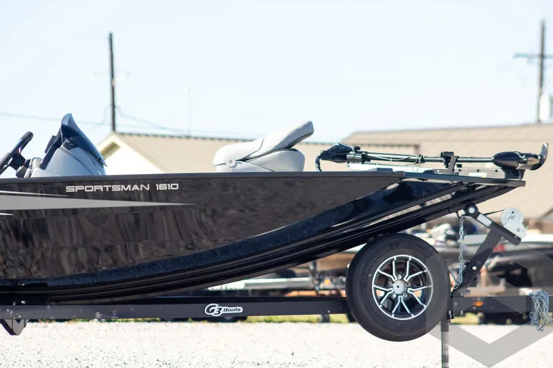 Slide: The Image of 2026 G3 Sportsman 1610 boat on trailer, side view, outdoors. - 6