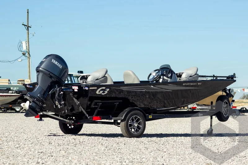 Slide: The Image of 2026 G3 Sportsman 1610 boat with Yamaha motor on trailer, parked on gravel. - 8