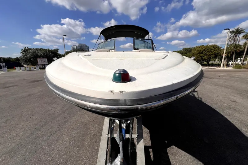 Slide: The Image of 2005 Sea Ray SLX 280 boat on trailer under blue sky with clouds. - 10