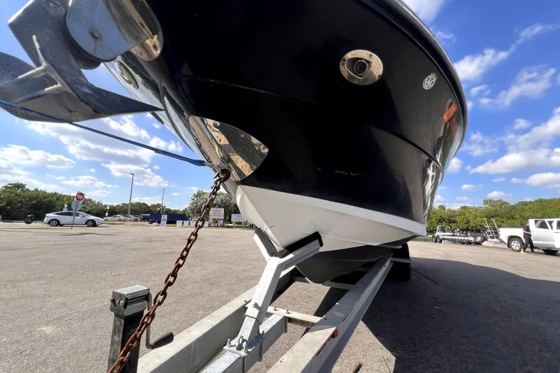 Slide: The Image of 2005 Sea Ray SLX 280 boat on trailer under clear blue sky. - 11