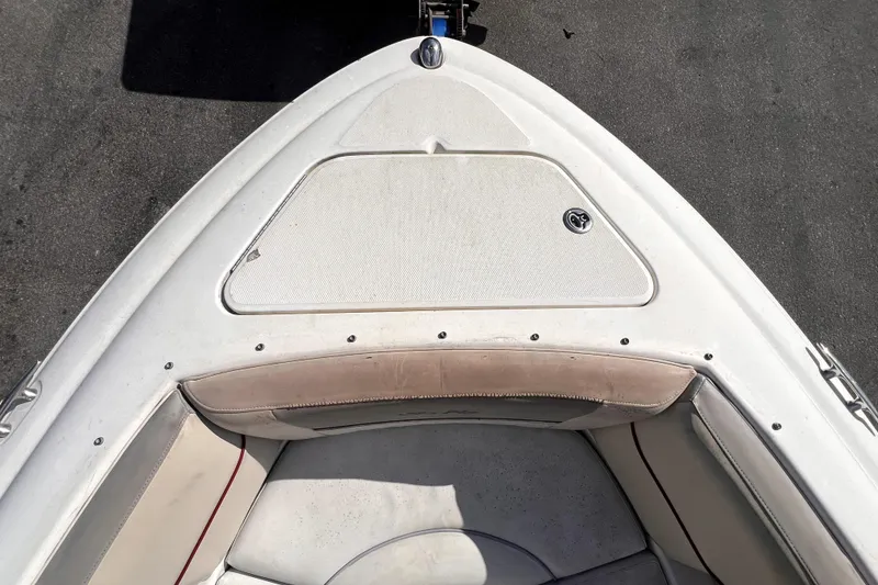 Slide: The Image of 2005 Sea Ray SLX 280 boat interior with white seating and cup holders. - 20
