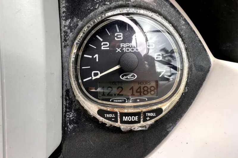 Slide: The Image of Dashboard of a 2005 Sea Ray SLX 280 boat with steering wheel and gauges. - 33