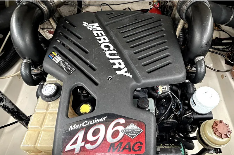 Slide: The Image of 2005 Sea Ray SLX 280 boat on trailer under a sunny sky. - 6