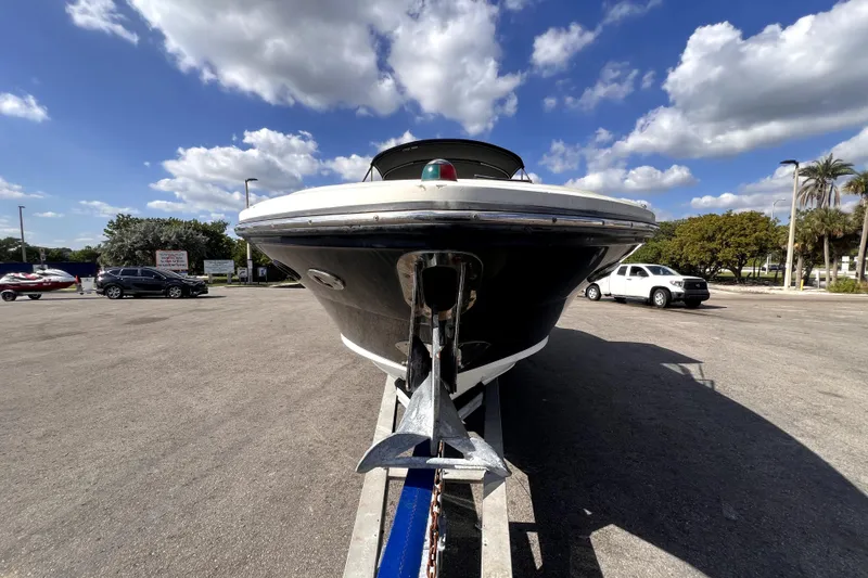 Slide: The Image of 2005 Sea Ray SLX 280 boat on trailer under a blue sky with clouds. - 8