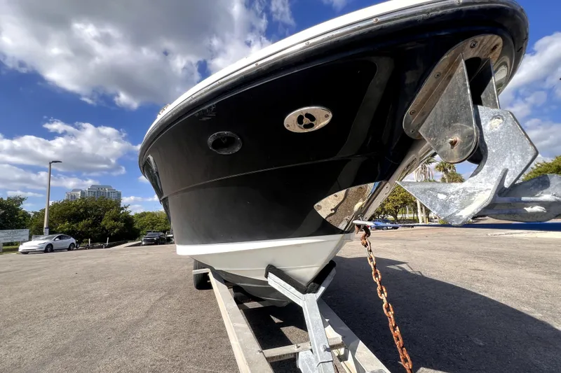 Slide: The Image of 2005 Sea Ray SLX 280 boat on trailer under blue sky with clouds. - 9