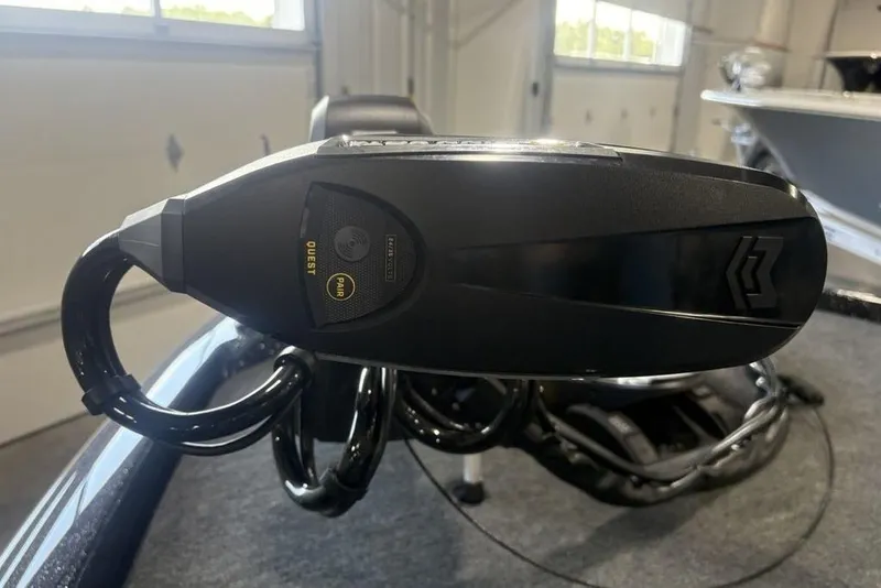 Slide: The Image of Close-up of 2026 Skeeter ZXE20 boat component in a garage setting. - 11