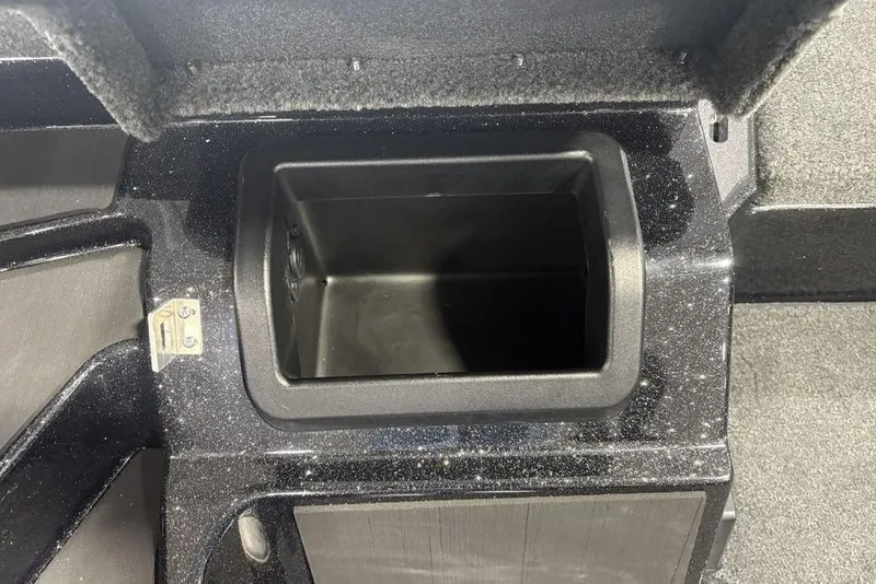 Slide: The Image of Storage compartment in 2026 Skeeter ZXE20 boat, featuring a sleek black interior design. - 12