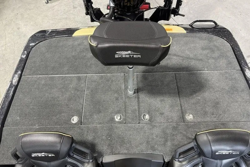 Slide: The Image of 2026 Skeeter ZXE20 boat interior with cushioned seating and carpeted deck. - 25
