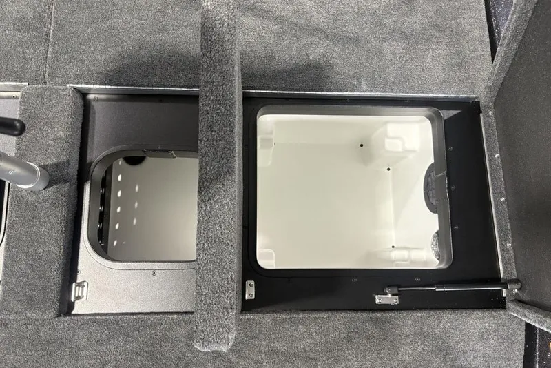 Slide: The Image of 2026 Skeeter ZXE20 boat storage compartments with open lids, showcasing interior space. - 28