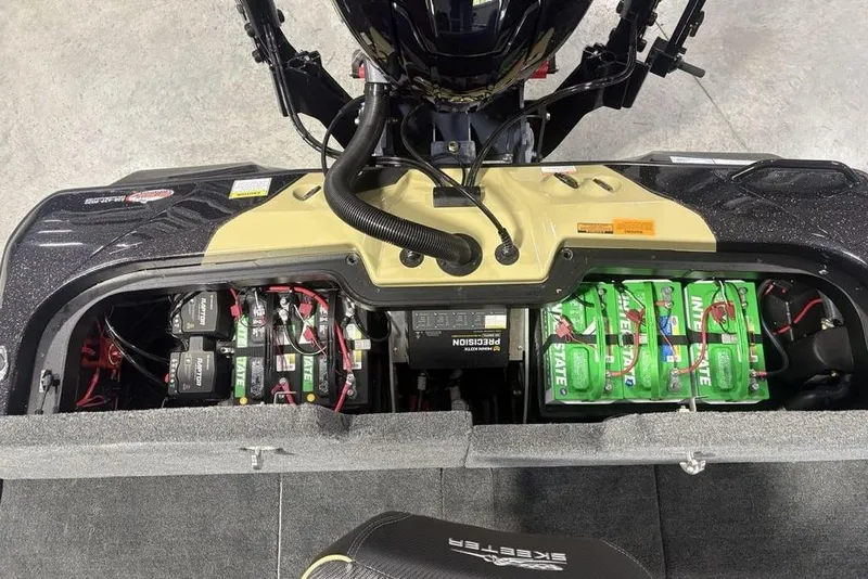 Slide: The Image of 2026 Skeeter ZXE20 boat battery compartment with multiple batteries and wiring. - 30
