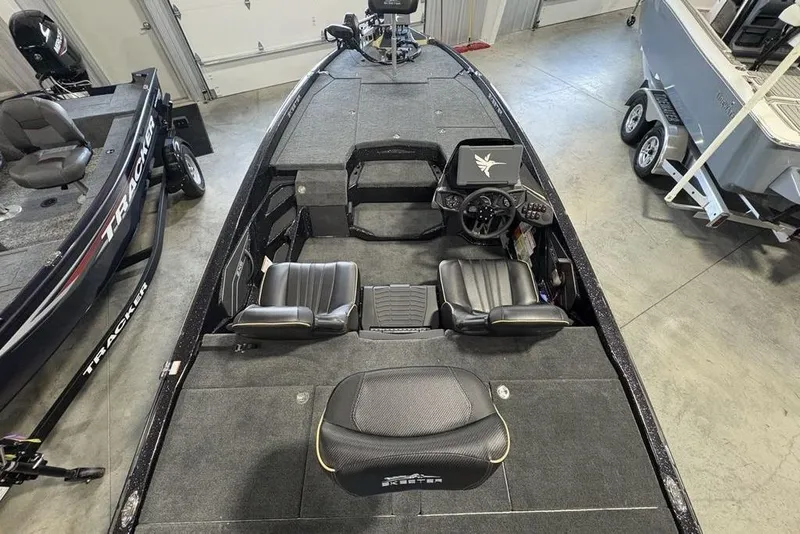 Slide: The Image of 2026 Skeeter ZXE20 fishing boat interior with dual seats and steering console. - 32