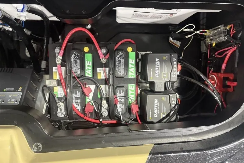 Slide: The Image of Battery compartment of 2026 Skeeter ZXE20 with multiple batteries and wiring connections. - 33