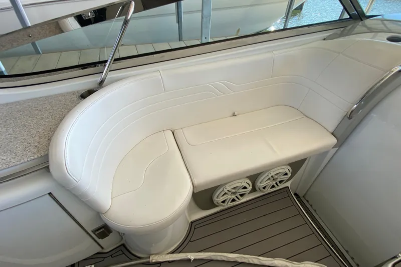 Slide: The Image of 2006 Formula 400 Super Sport boat interior with white seating and speakers. - 10