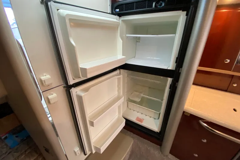 Slide: The Image of Open refrigerator in 2006 Formula 400 Super Sport boat interior. - 20