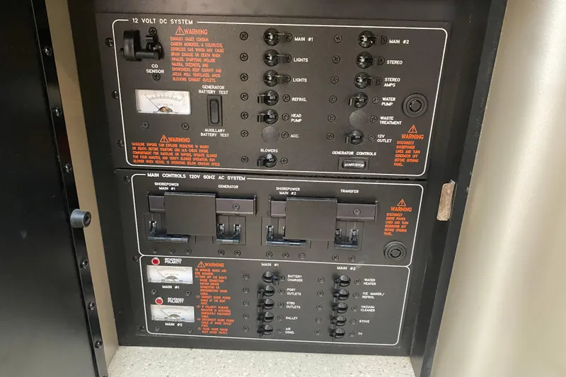 Slide: The Image of Control panel of a 2006 Formula 400 Super Sport boat, featuring electrical system switches. - 25