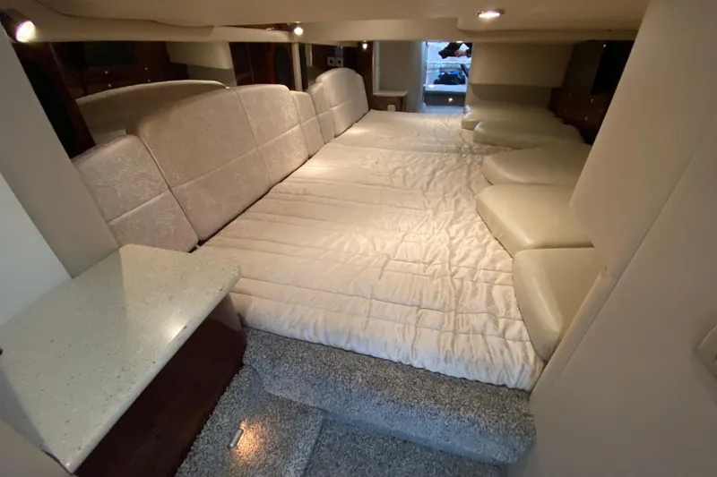 Slide: The Image of Interior cabin of 2006 Formula 400 Super Sport boat with spacious bed and seating. - 26