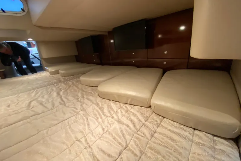 Slide: The Image of Interior cabin of 2006 Formula 400 Super Sport yacht with beige seating and wood paneling. - 28