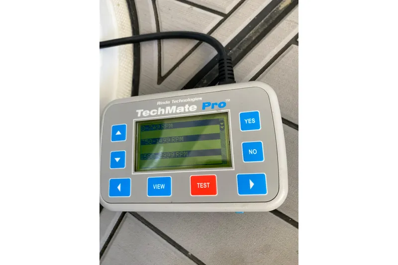 Slide: The Image of TechMate Pro diagnostic tool displaying RPM readings for 2006 Formula 400 Super Sport. - 34