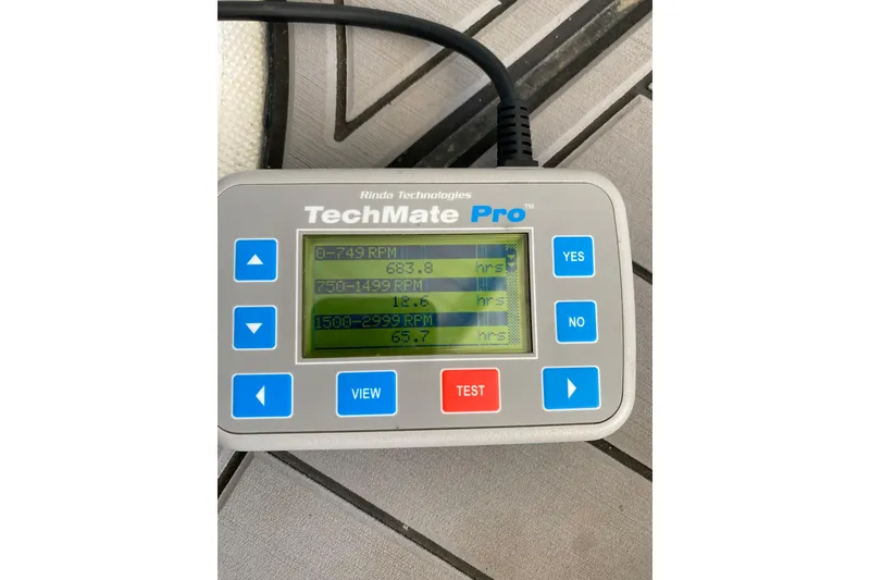 Slide: The Image of TechMate Pro diagnostic tool displaying RPM hours for a 2006 Formula 400 Super Sport. - 35