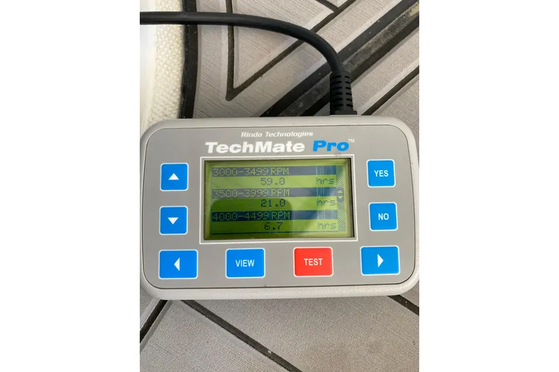 Slide: The Image of TechMate Pro diagnostic tool displaying RPM hours for a 2006 Formula 400 Super Sport. - 36