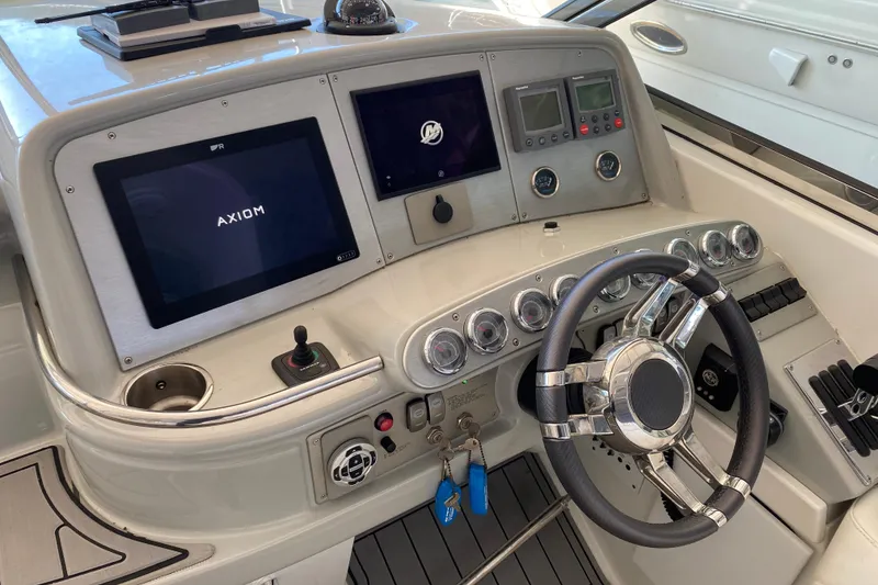 Slide: The Image of Dashboard of a 2006 Formula 400 Super Sport boat with modern controls and steering wheel. - 39