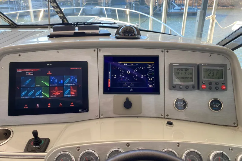 Slide: The Image of Control panel of a 2006 Formula 400 Super Sport boat with navigation displays. - 40
