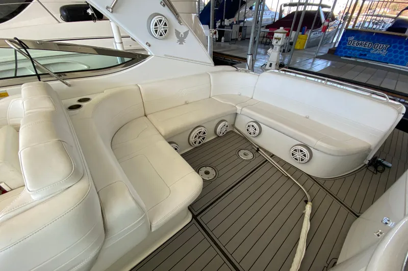 Slide: The Image of 2006 Formula 400 Super Sport boat interior with white seating and sleek design. - 7