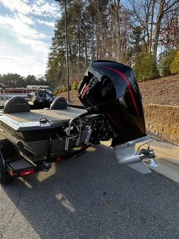 Slide: The Image of 2024 Vexus AVX2080 boat with powerful outboard motor, parked on a sunny day. - 3
