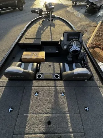 Slide: The Image of 2024 Vexus AVX2080 boat interior with dual seats and steering console. - 4