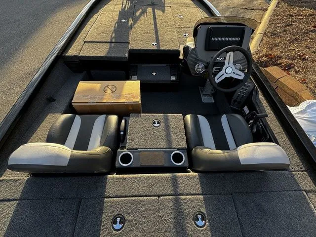 Slide: The Image of 2024 Vexus AVX2080 boat interior with dual seats and Humminbird electronics. - 5