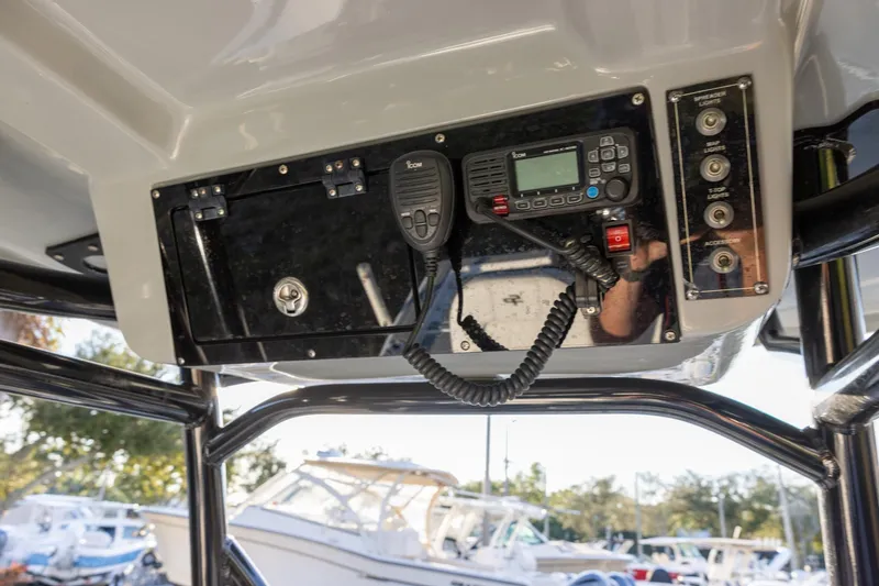 Slide: The Image of 2024 Sea Pro 210 Bay boat console with radio and control panel. - 11