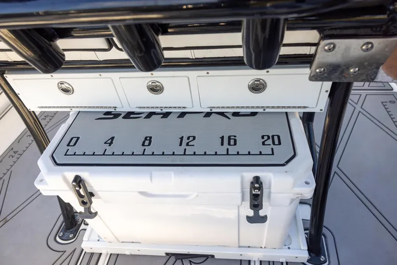 Slide: The Image of 2024 Sea Pro 210 Bay boat with storage compartments and cooler. - 7