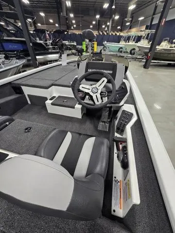 Slide: The Image of 2024 Vexus AVX2080 boat interior with steering wheel and seating in showroom. - 6