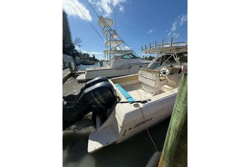 Slide: The Image of Intrepid 370 Cuddy 2008 cruising on open water, leaving a wake under a clear blue sky. - 10