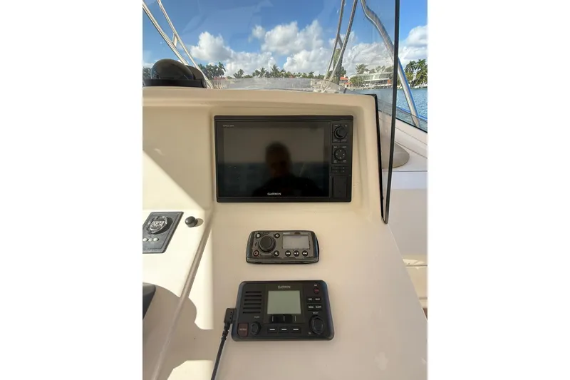 Slide: The Image of 2008 Intrepid 370 Cuddy boat interior with logo and seating area. - 25