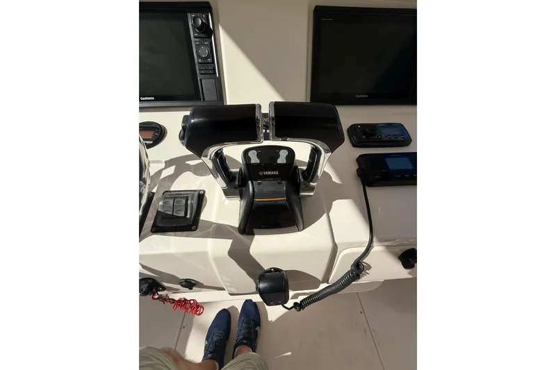 Slide: The Image of 2008 Intrepid 370 Cuddy boat interior with helm, seating, and water view. - 26