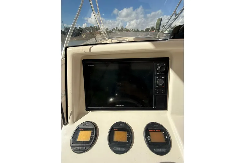 Slide: The Image of 2008 Intrepid 370 Cuddy boat interior with helm and seating area. - 28