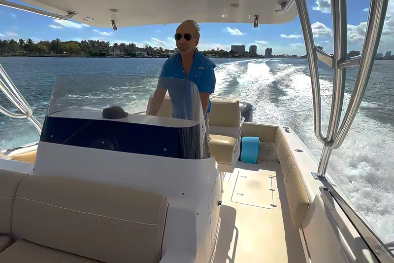 Slide: The Image of 2008 Intrepid 370 Cuddy boat docked in marina, front view. - 3