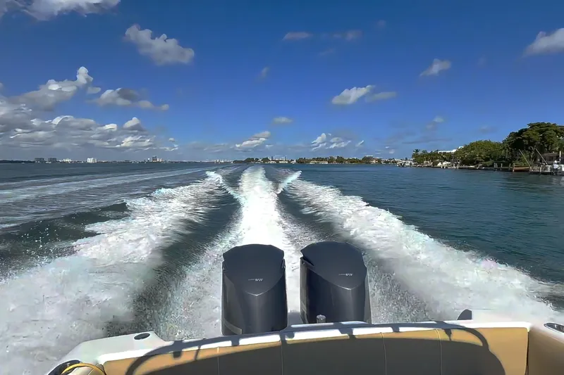 Slide: The Image of 2008 Intrepid 370 Cuddy boat docked in marina, side view. - 4