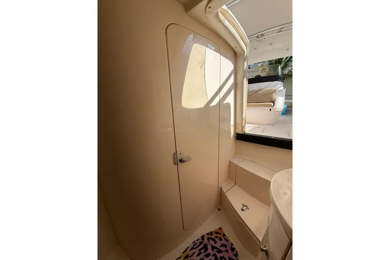 Slide: The Image of 2008 Intrepid 370 Cuddy cabin interior with beige seating and colorful accents. - 63