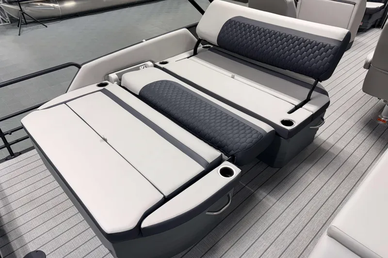 Slide: The Image of 2026 Sylvan L3 DLZ boat interior with modern seating and cup holders. - 18