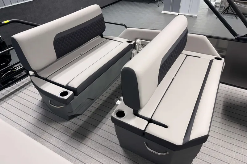 Slide: The Image of 2026 Sylvan L3 DLZ boat interior with modern seating and cup holders. - 19