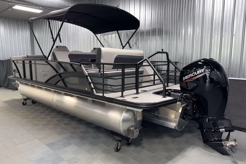 Slide: The Image of 2026 Sylvan L3 DLZ pontoon boat with Mercury outboard motor in a showroom. - 26