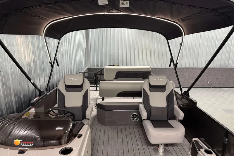 Slide: The Image of 2026 Sylvan L3 DLZ pontoon boat interior with seating and canopy. - 8