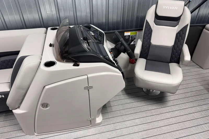 Slide: The Image of 2026 Sylvan L3 DLZ boat interior with captain's chair and control console. - 9