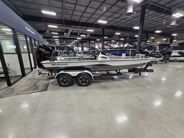 The Image of 2024 Vexus AVX2080 boat displayed in a showroom with sleek design and modern features. - 1
