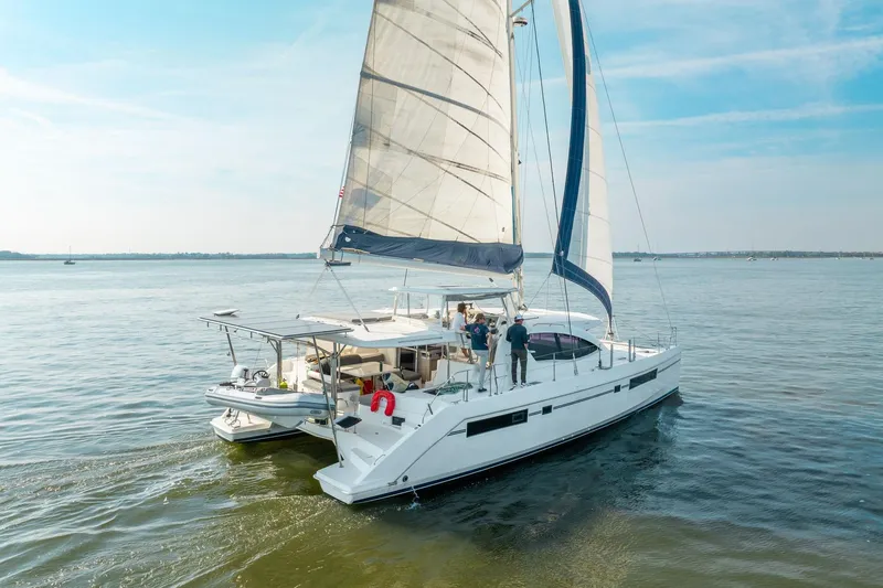 Slide: The Image of 2016 Leopard 48 catamaran sailing on calm waters under a clear blue sky. - 10