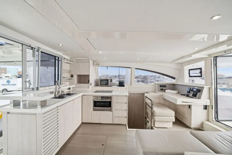 Slide: The Image of Luxurious interior of 2016 Leopard 48 yacht with modern kitchen and navigation area. - 100